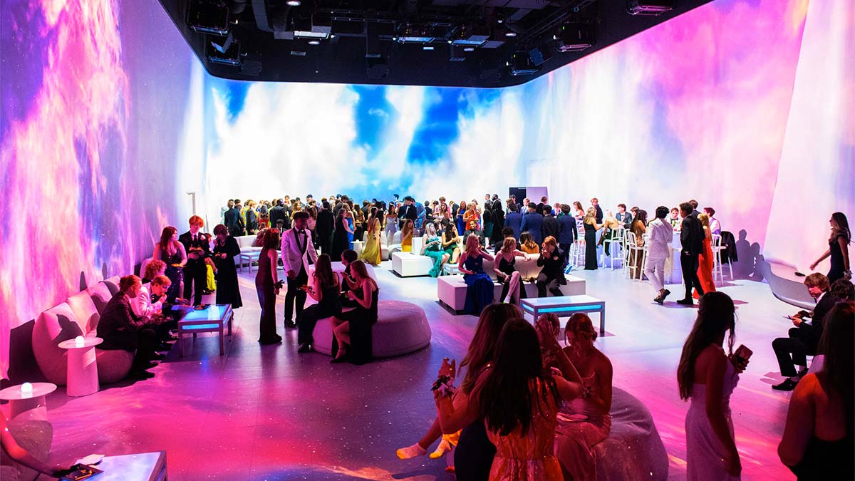 Lots of people inside the illuminarium